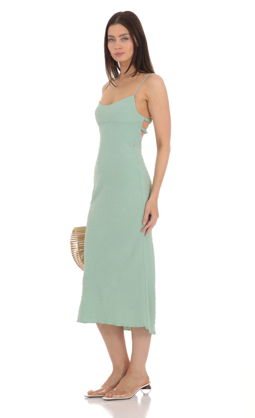 Picture Dotted Open Back Midi Dress in Green. Source: https://media-img.lucyinthesky.com/data/Apr24/850xAUTO/5afc8539-2f45-4dd2-8afb-69354d00e26d.jpg