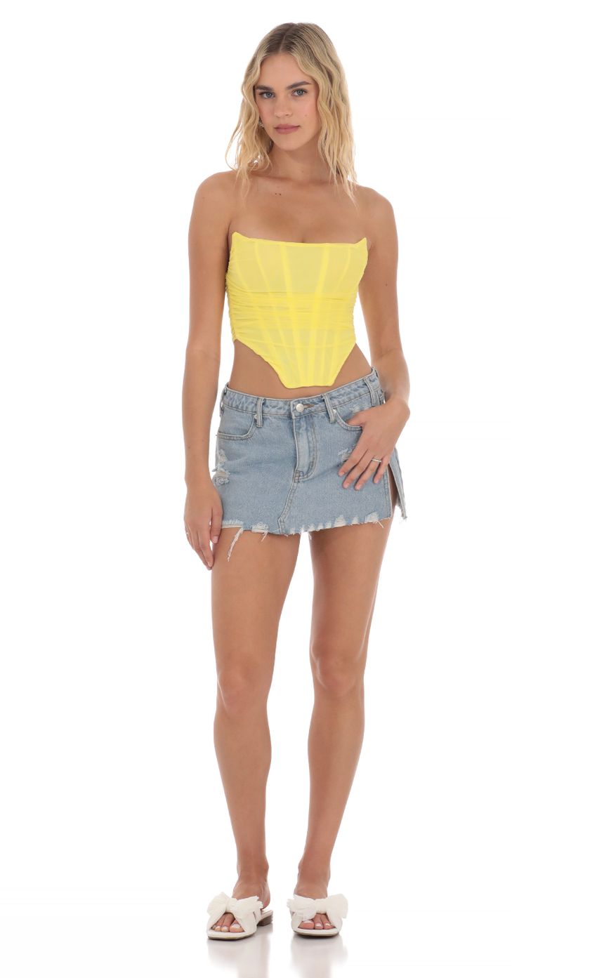 Picture Corset Top in Yellow. Source: https://media-img.lucyinthesky.com/data/Apr24/850xAUTO/64ad3992-3cba-470d-9948-9955ddfe44c7.jpg