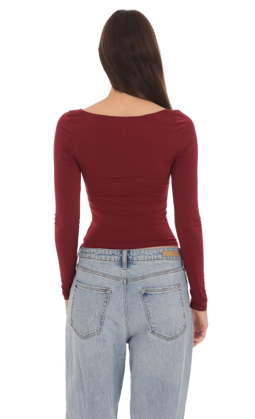 Picture Fitted Long Sleeve Top in Maroon. Source: https://media-img.lucyinthesky.com/data/Apr24/850xAUTO/67b73271-adbe-4ff1-9840-ee7758a7331c.jpg