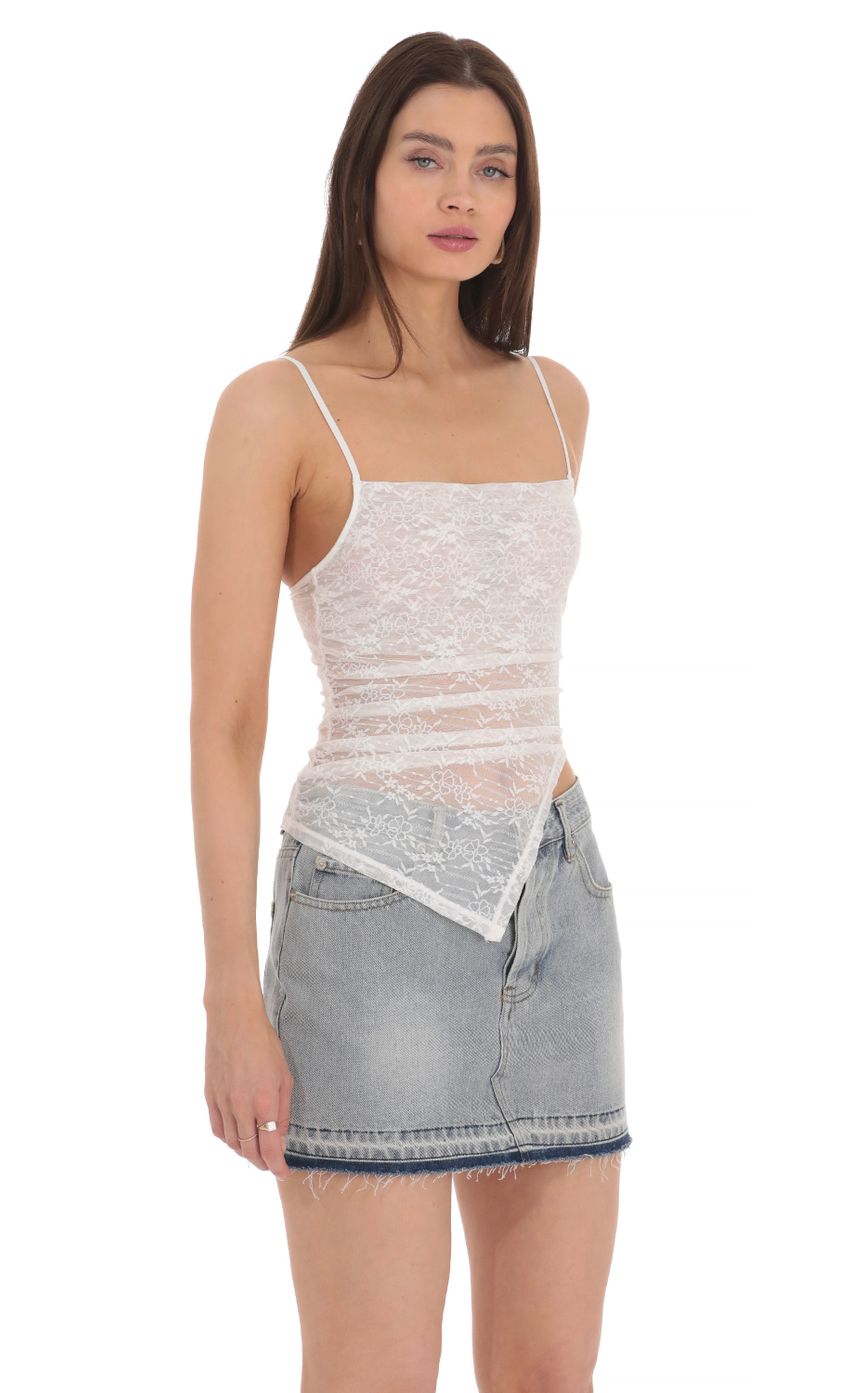 Picture Sheer Lace Asymmetrical Top in White. Source: https://media-img.lucyinthesky.com/data/Apr24/850xAUTO/6982eb2a-055a-4a73-914f-ddbf76d1e626.jpg
