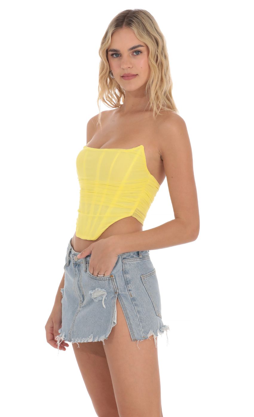 Picture Corset Top in Yellow. Source: https://media-img.lucyinthesky.com/data/Apr24/850xAUTO/6d61a58c-c09e-45c9-93bd-ebcd6b5fb38a.jpg