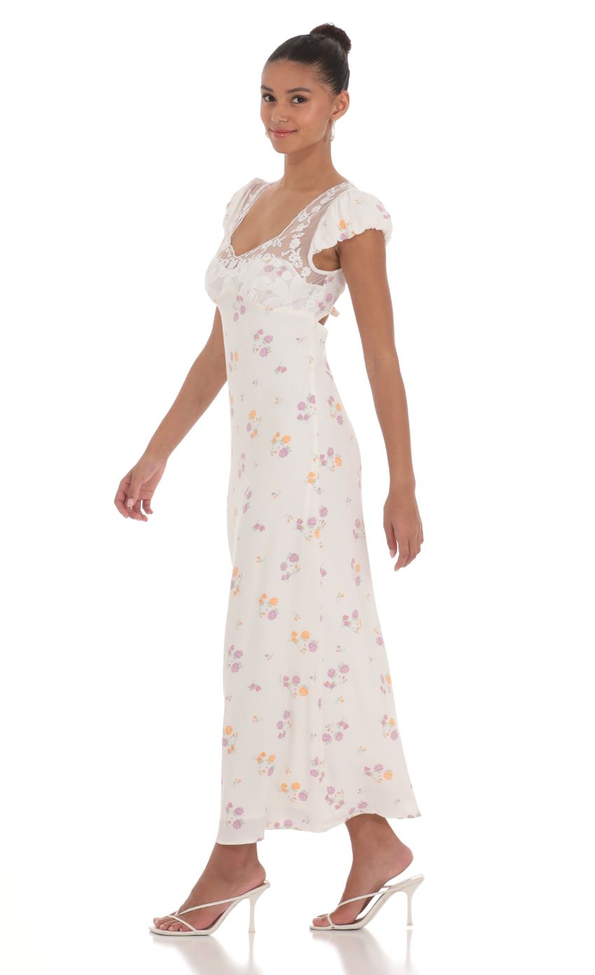 Picture Puff Sleeve Floral Maxi Dress in White. Source: https://media-img.lucyinthesky.com/data/Apr24/850xAUTO/70fafa98-994e-4d54-a83a-76a44c54f30d.jpg