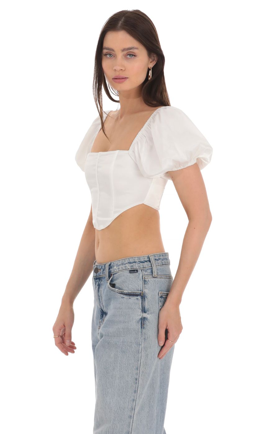 Picture Satin Puff Sleeve Corset Top in White. Source: https://media-img.lucyinthesky.com/data/Apr24/850xAUTO/71fe2026-f237-4b12-bf6e-9cfb3663814d.jpg