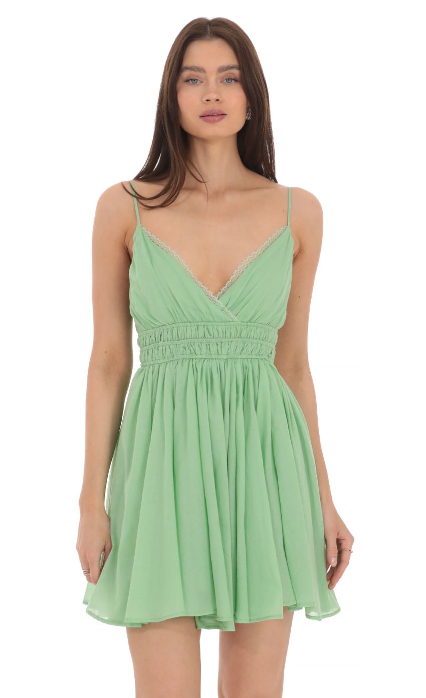 Picture Lace Trim V-Neck Dress in Green. Source: https://media-img.lucyinthesky.com/data/Apr24/850xAUTO/7b96d373-0ed0-4dca-b0c8-e630e1c6f4ea.jpg