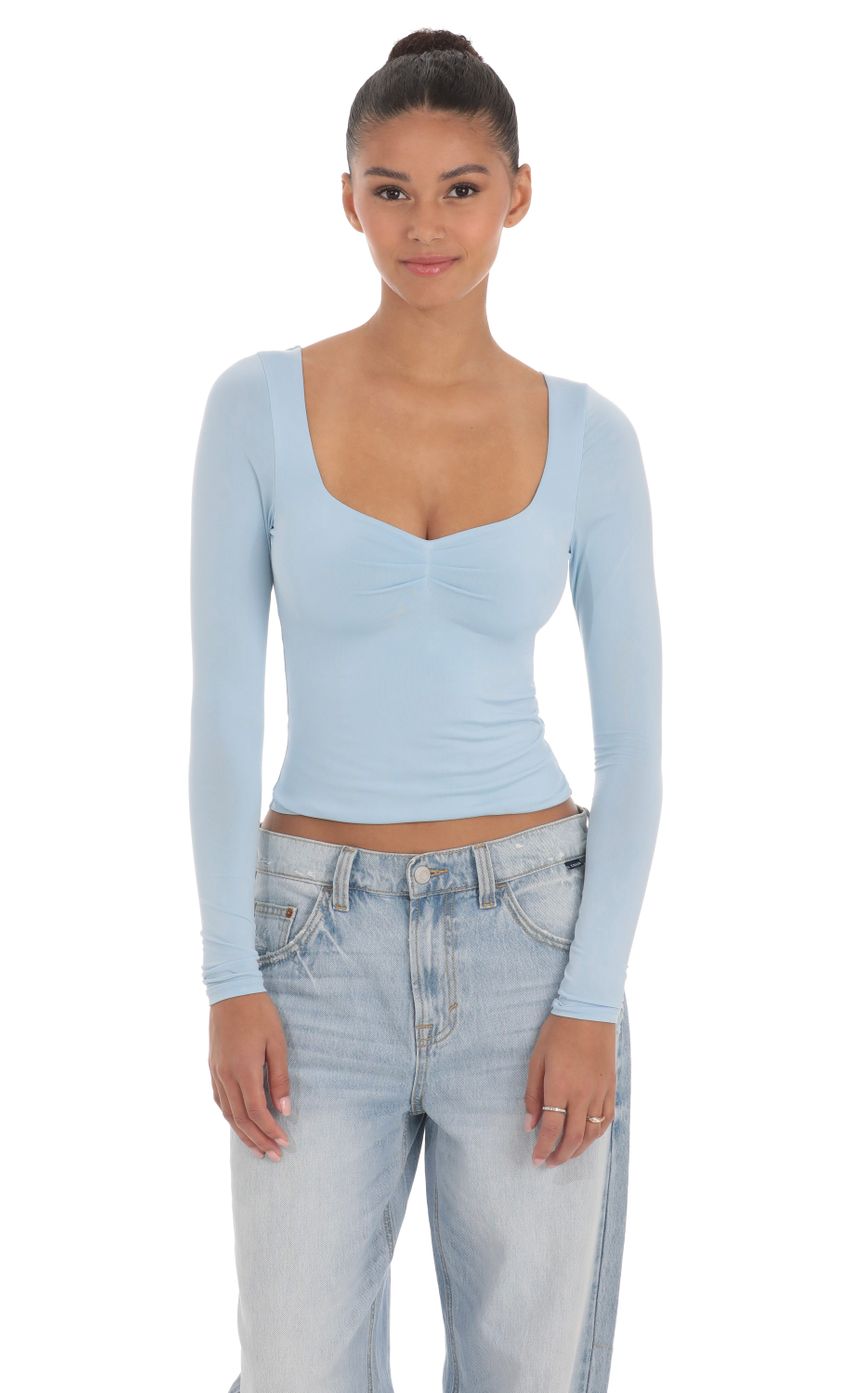 Picture Fitted Long Sleeve Top in Baby Blue. Source: https://media-img.lucyinthesky.com/data/Apr24/850xAUTO/7d797706-6c03-4c51-9ed4-e469039103bc.jpg