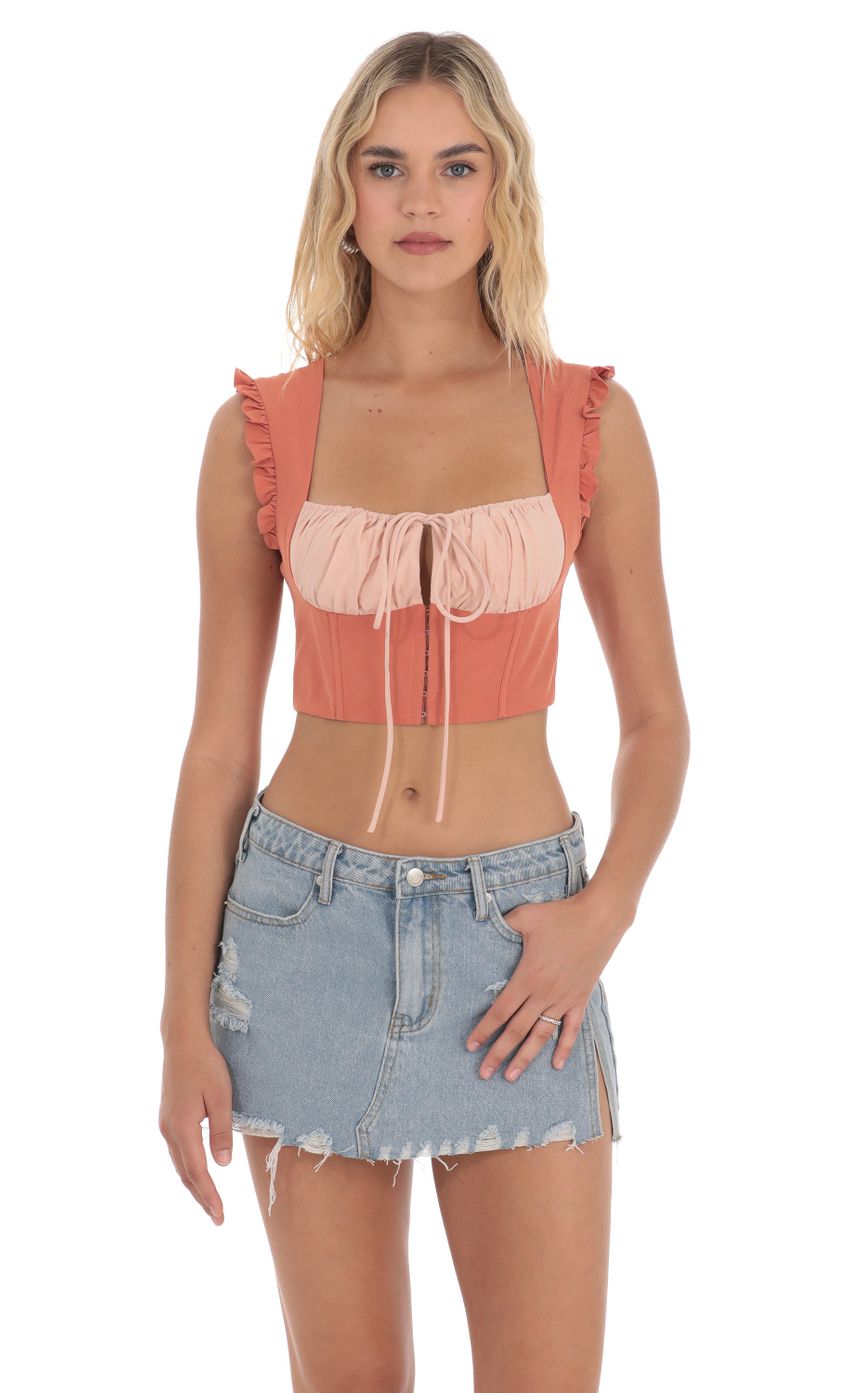 Picture Two Toned Ruffle Top in Orange. Source: https://media-img.lucyinthesky.com/data/Apr24/850xAUTO/8941f7c8-abc5-423a-8b36-bc2ecd9aef17.jpg