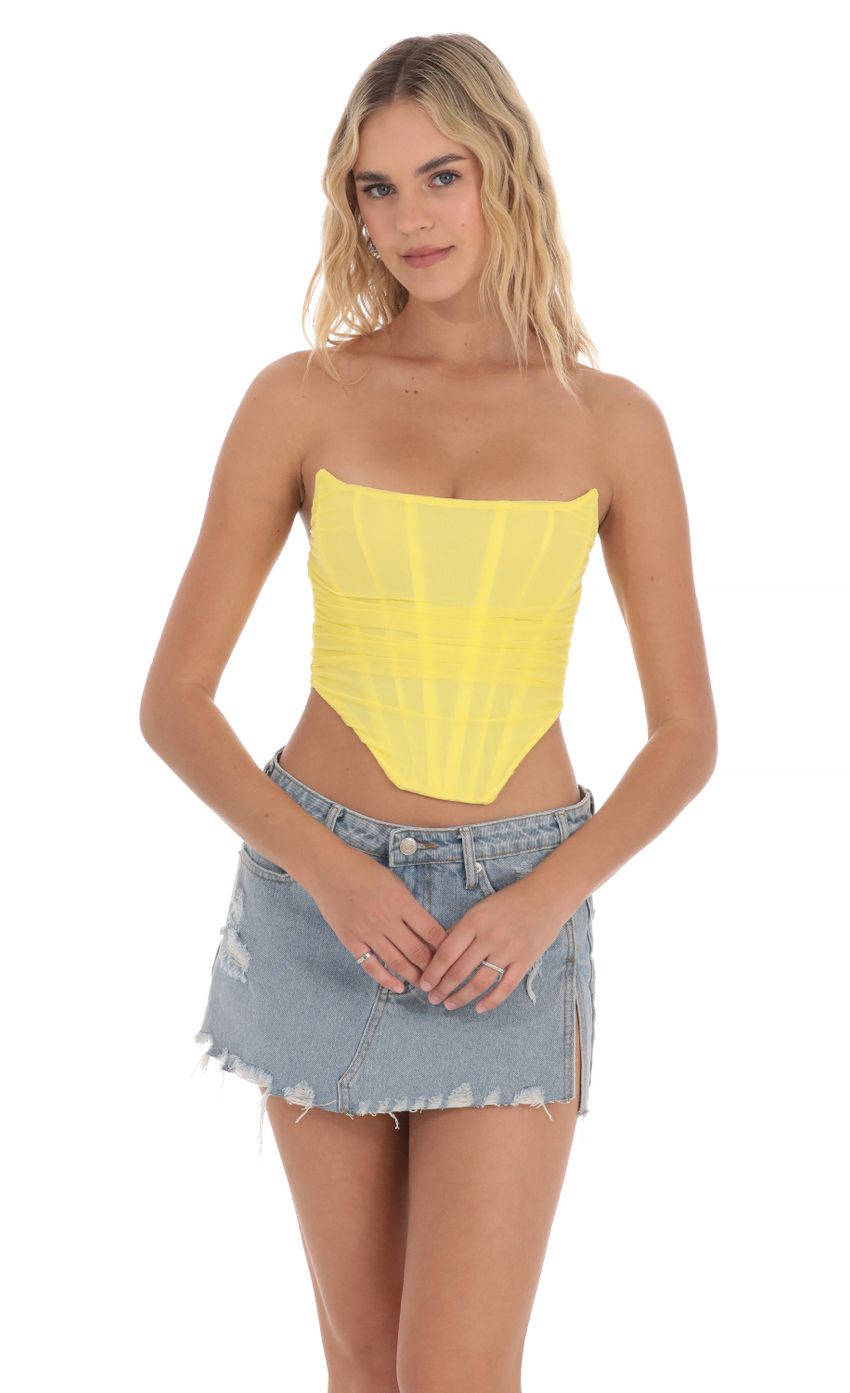 Picture Corset Top in Yellow. Source: https://media-img.lucyinthesky.com/data/Apr24/850xAUTO/a5217b86-4c02-42c4-a687-f490c3ff9dbd.jpg
