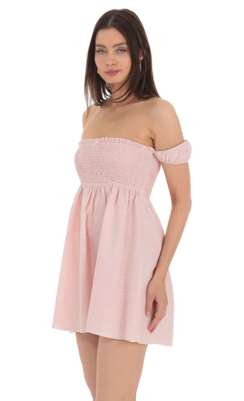 Picture Striped Smocked Off Shoulder Dress in Pink. Source: https://media-img.lucyinthesky.com/data/Apr24/850xAUTO/a8dba7f6-cf90-430a-9d6b-e65dded97486.jpg