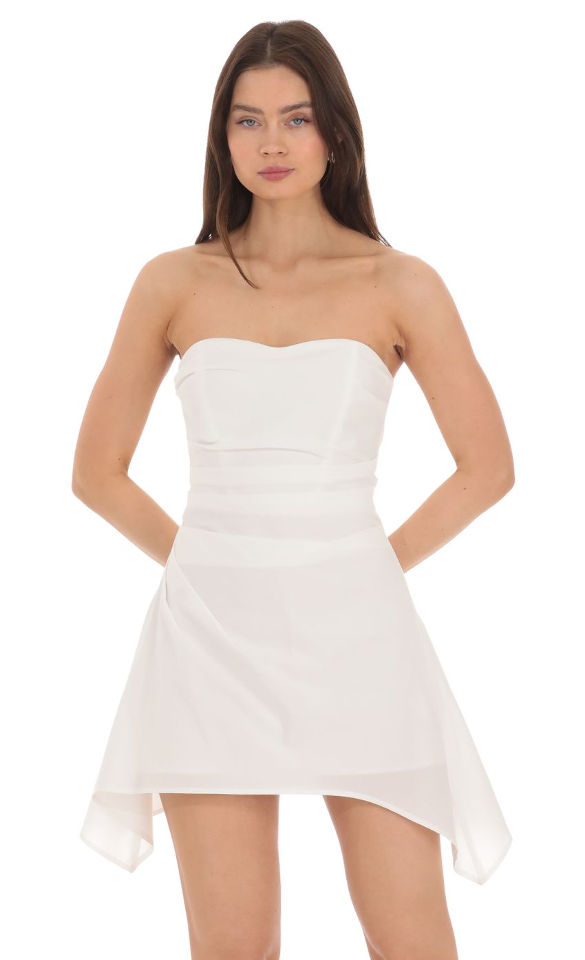Picture Strapless Asymmetrical Dress in White. Source: https://media-img.lucyinthesky.com/data/Apr24/850xAUTO/a90e6a17-a2bb-439f-8be7-b473c782eee9.jpg