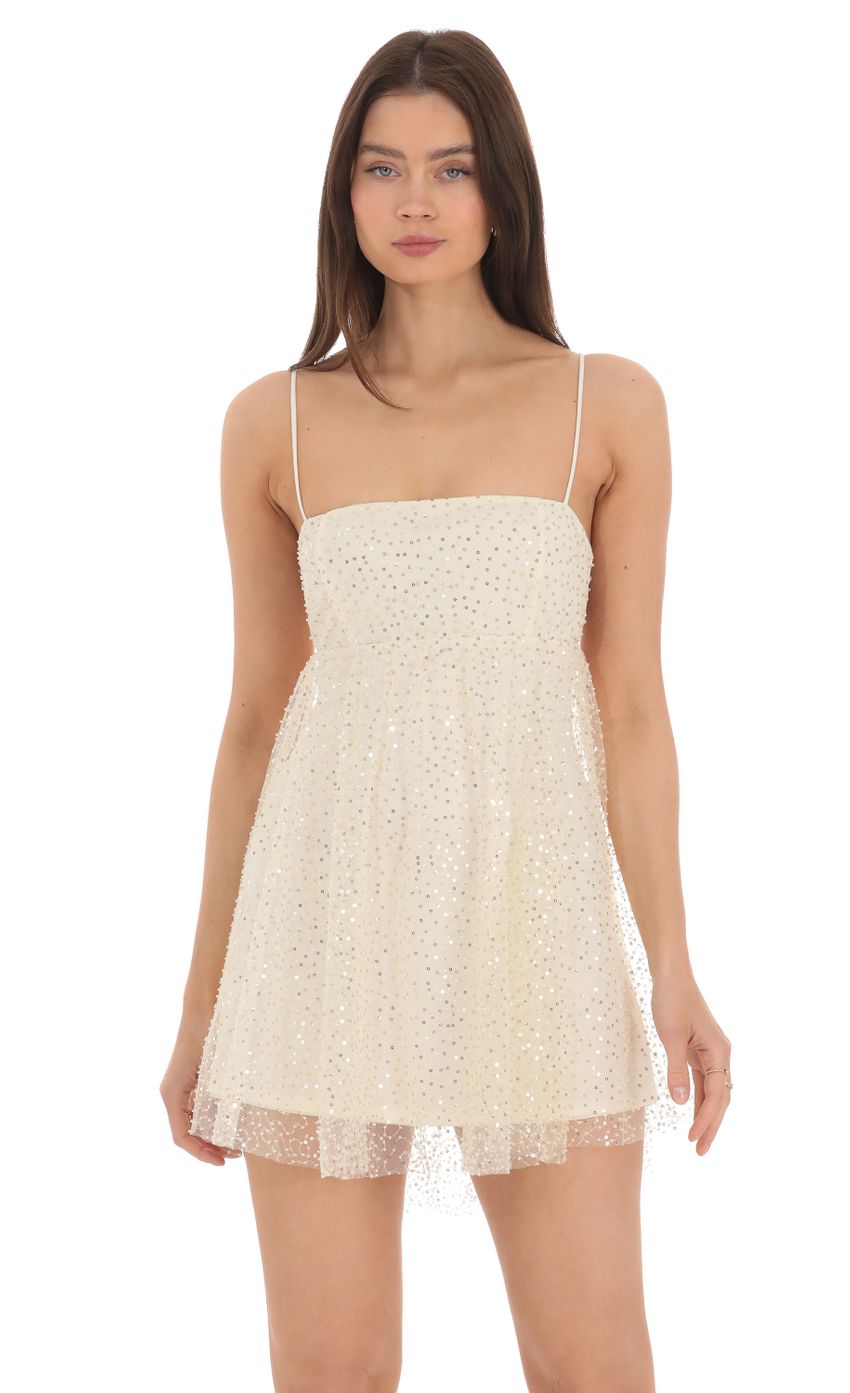 Picture Sequin Beaded Babydoll Dress in Cream. Source: https://media-img.lucyinthesky.com/data/Apr24/850xAUTO/a953092c-eb37-4b39-8257-1421afad67bb.jpg