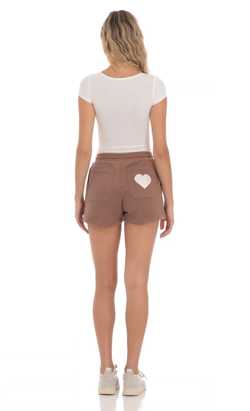 Picture Lucy in the Sky Sweat Shorts in Brown. Source: https://media-img.lucyinthesky.com/data/Apr24/850xAUTO/bdae8bc7-afb2-4a0e-9fca-8435f8029210.jpg