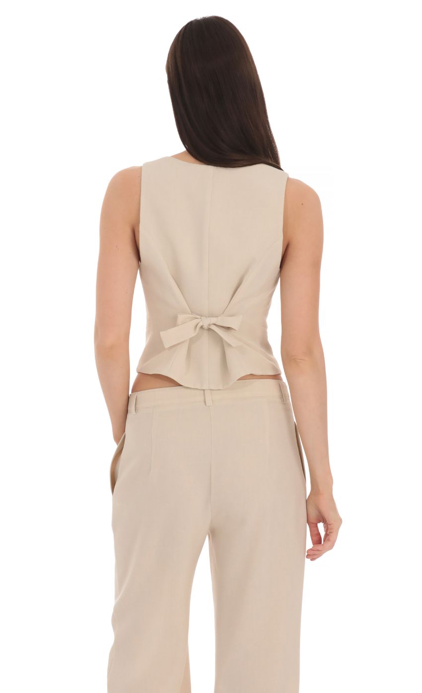 Picture Linen Buttoned Vest in Cream. Source: https://media-img.lucyinthesky.com/data/Apr24/850xAUTO/c262cc7a-d7c3-4732-97d7-307a18627d30.jpg