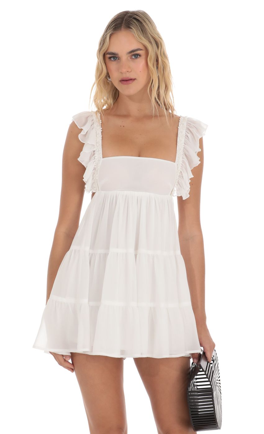 Picture Floral Ruffle Strap Babydoll Romper in White. Source: https://media-img.lucyinthesky.com/data/Apr24/850xAUTO/d0289a4e-21bf-402a-9f98-efb7ecbf05aa.jpg