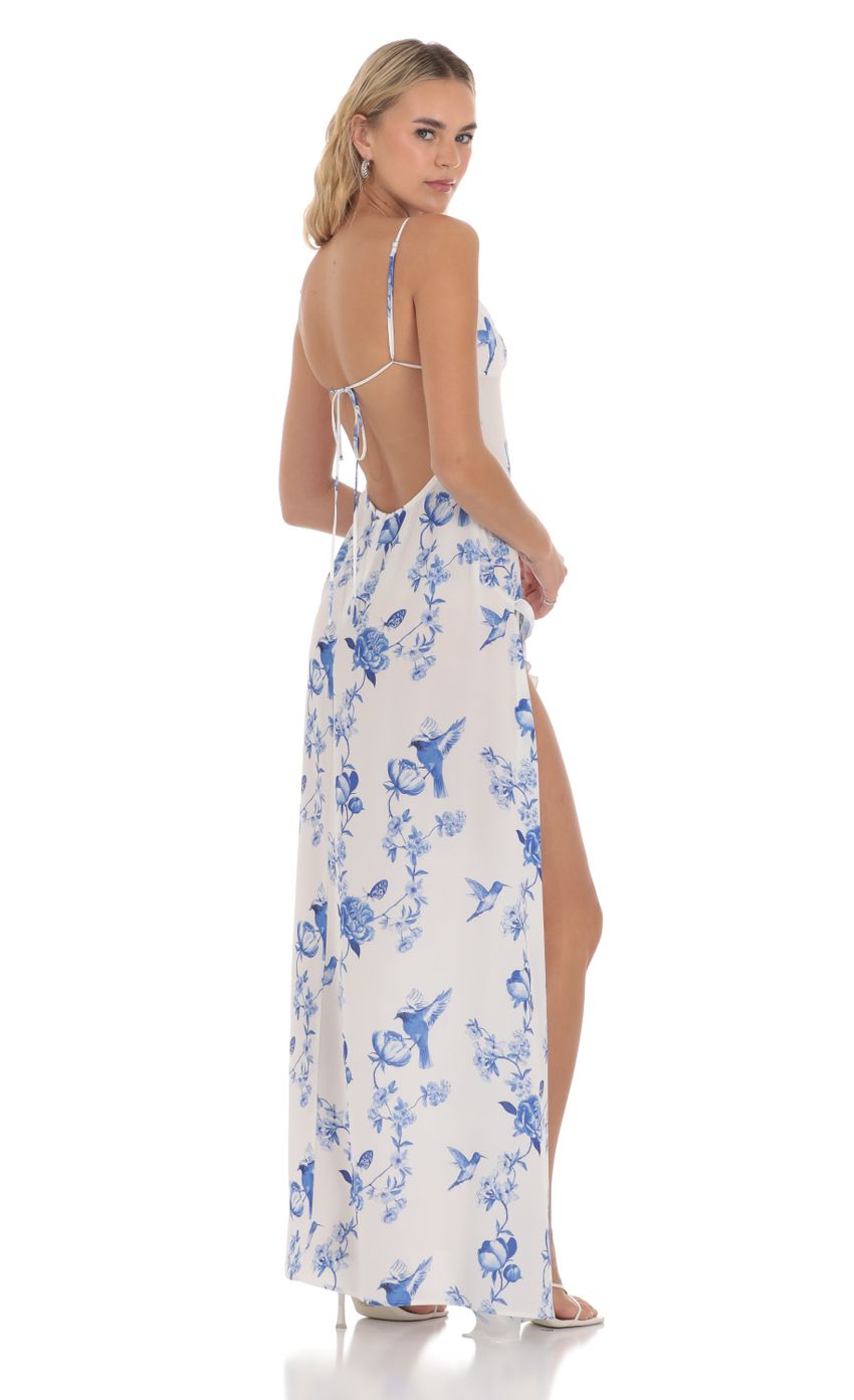 Picture Floral Ruffle Slit Maxi Dress in White. Source: https://media-img.lucyinthesky.com/data/Apr24/850xAUTO/d3de7ebc-914c-497c-a6ef-eb459be9f50d.jpg