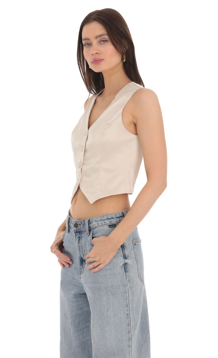 Picture Satin Button Vest Top in Cream. Source: https://media-img.lucyinthesky.com/data/Apr24/850xAUTO/d8099503-308c-4804-b16f-8a21e8041aa3.jpg