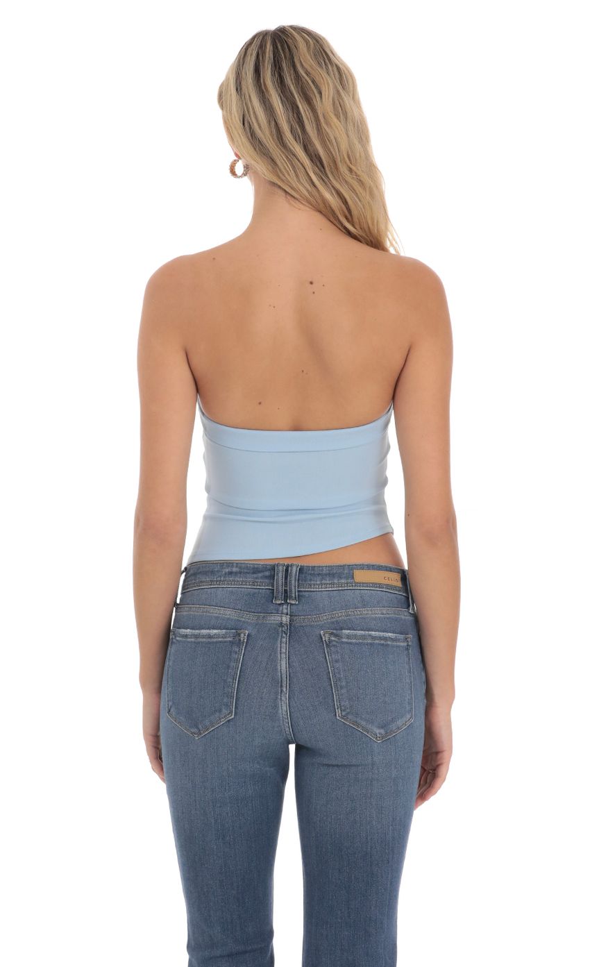 Picture Strapless Asymmetrical Top in Light Blue. Source: https://media-img.lucyinthesky.com/data/Apr24/850xAUTO/deebaf52-483e-4913-87a3-70caf18476ad.jpg