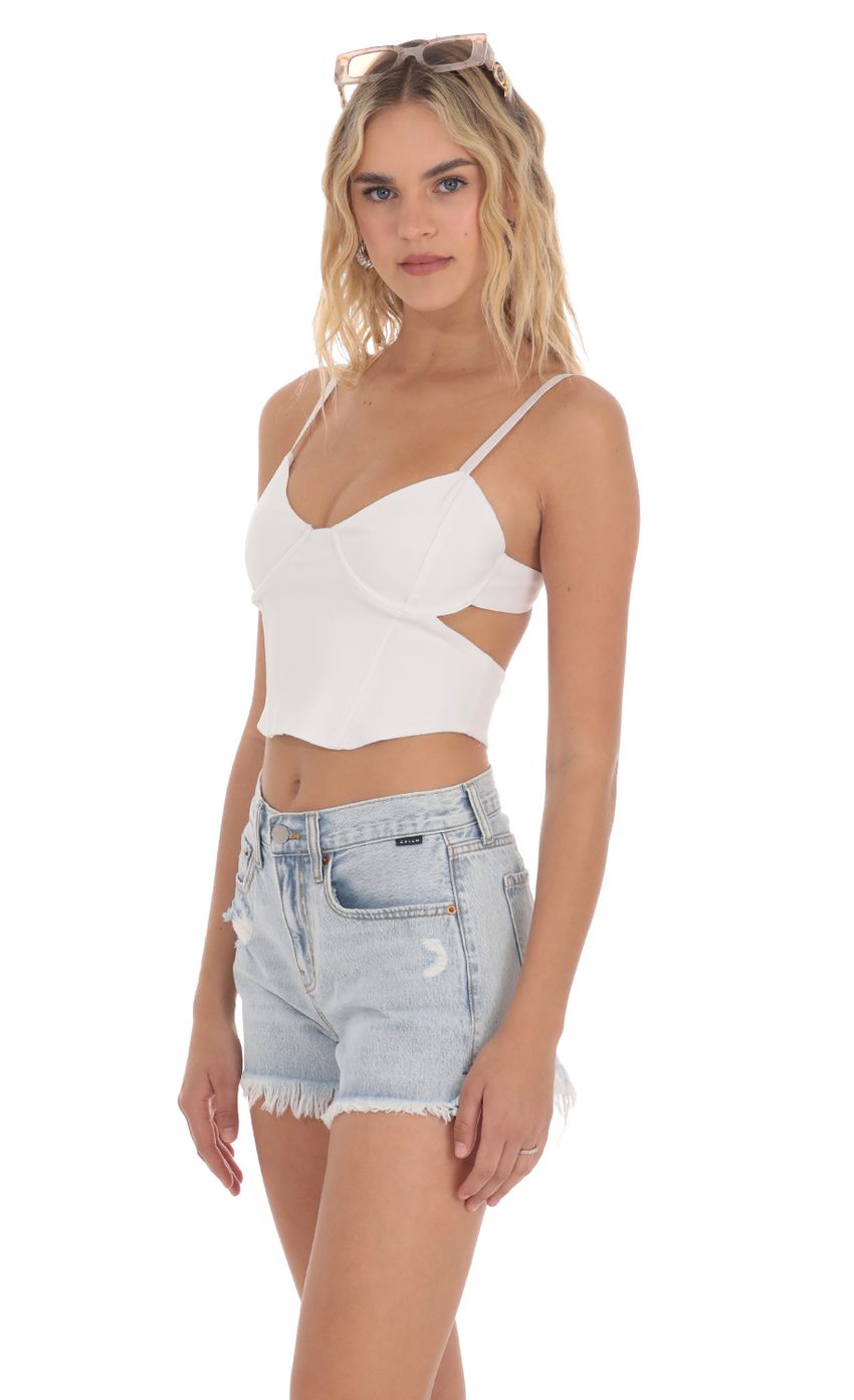 Picture Cutout Top in White. Source: https://media-img.lucyinthesky.com/data/Apr24/850xAUTO/df254fa8-62d6-4870-84d2-67b5567605a3.jpg