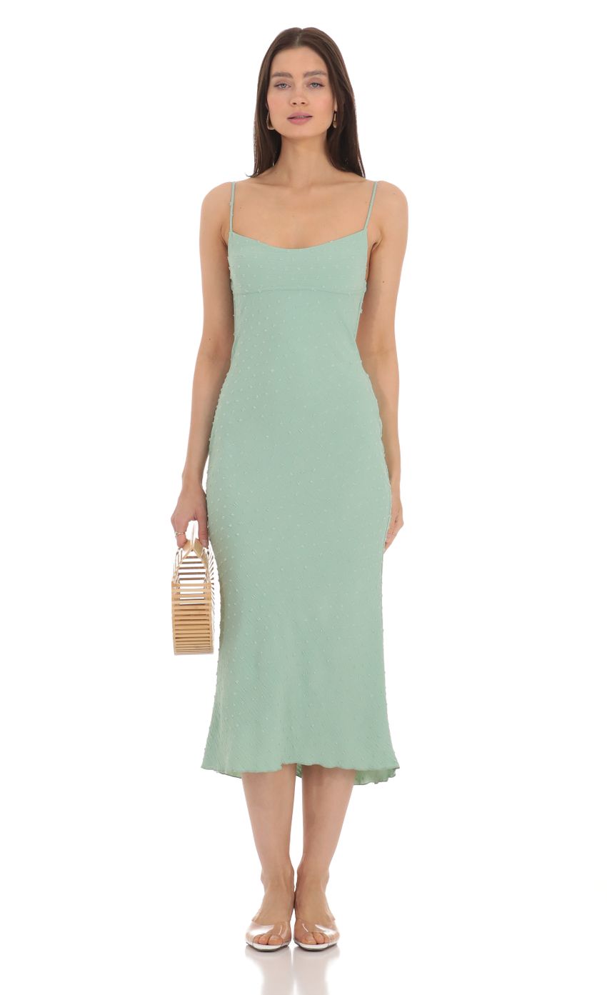 Picture Dotted Open Back Midi Dress in Green. Source: https://media-img.lucyinthesky.com/data/Apr24/850xAUTO/e071b109-fcff-4075-8f9f-4457aaf9cb12.jpg
