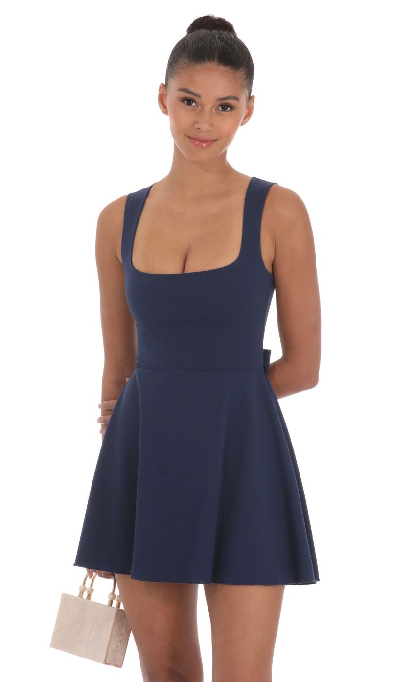 Picture Back Bow A-Line Dress in Navy. Source: https://media-img.lucyinthesky.com/data/Apr24/850xAUTO/e0734d0c-7af9-4817-8ad6-f768e9731165.jpg