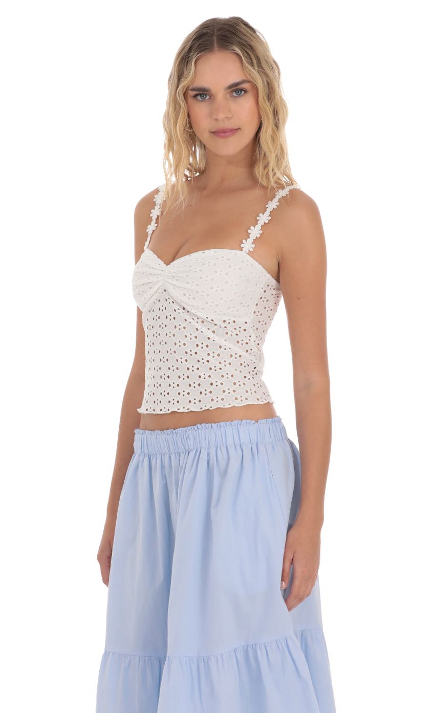 Picture Floral Strap Eyelet Top in White. Source: https://media-img.lucyinthesky.com/data/Apr24/850xAUTO/e77403e3-e53e-4c48-953e-9978db3a1936.jpg
