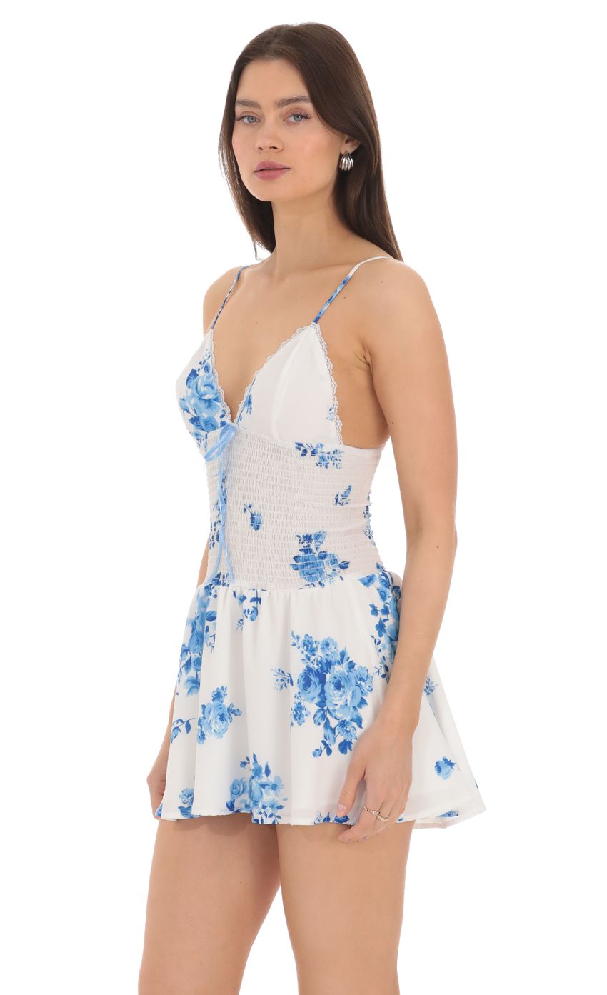 Picture Blue Floral Smocked Ruffle Dress in White. Source: https://media-img.lucyinthesky.com/data/Apr24/850xAUTO/e796c59e-2b29-4b20-a13c-1374b20e01a8.jpg
