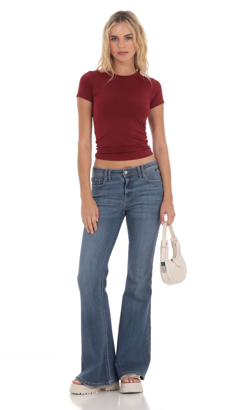 Picture Stretch Short Sleeve Top in Maroon. Source: https://media-img.lucyinthesky.com/data/Apr24/850xAUTO/ef662bad-a489-4026-830b-097b4c19f12c.jpg