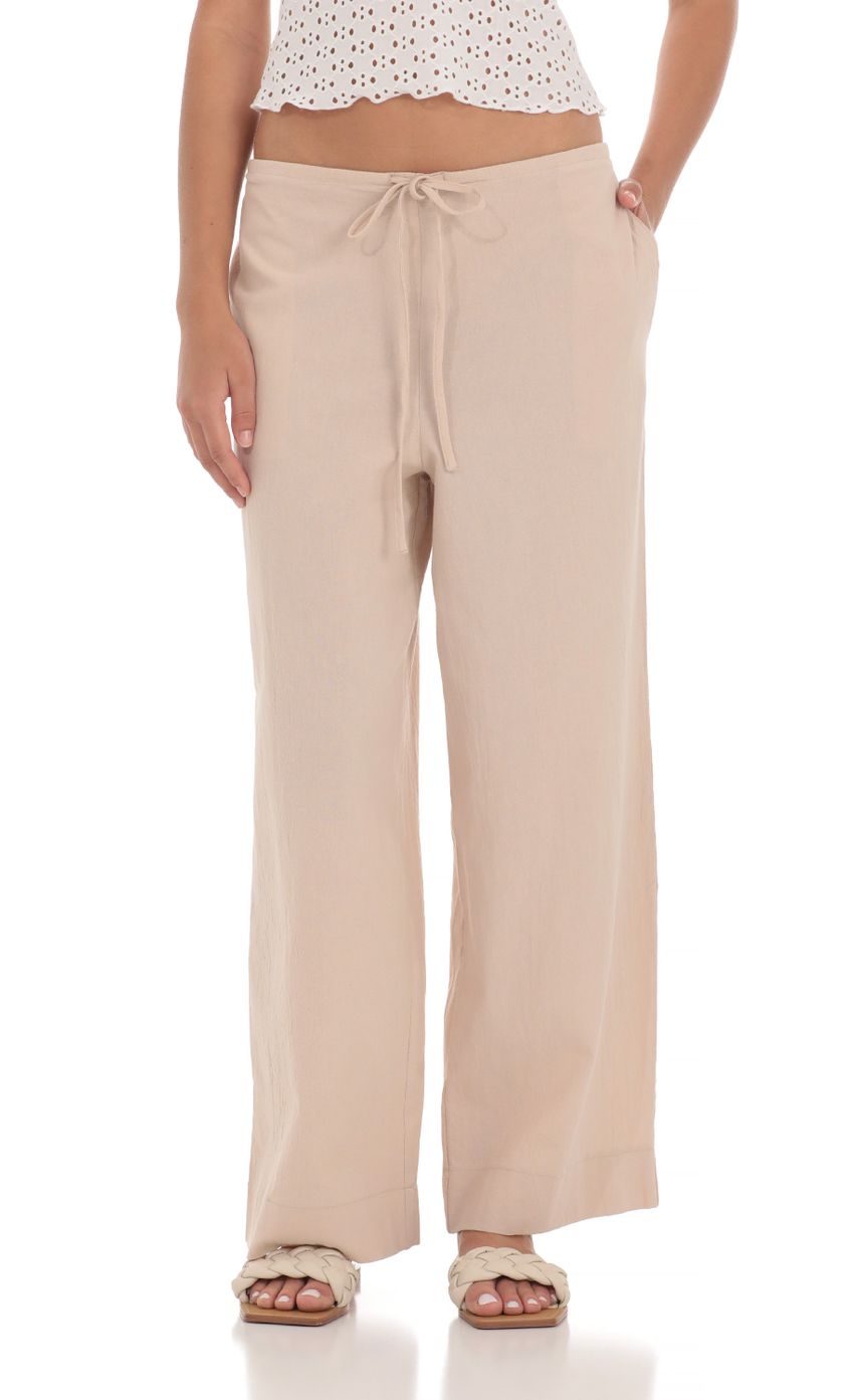 Picture Low Rise Straight Pants in Light Brown. Source: https://media-img.lucyinthesky.com/data/Apr24/850xAUTO/f9120cf8-92dc-4859-a405-6347b3427633.jpg