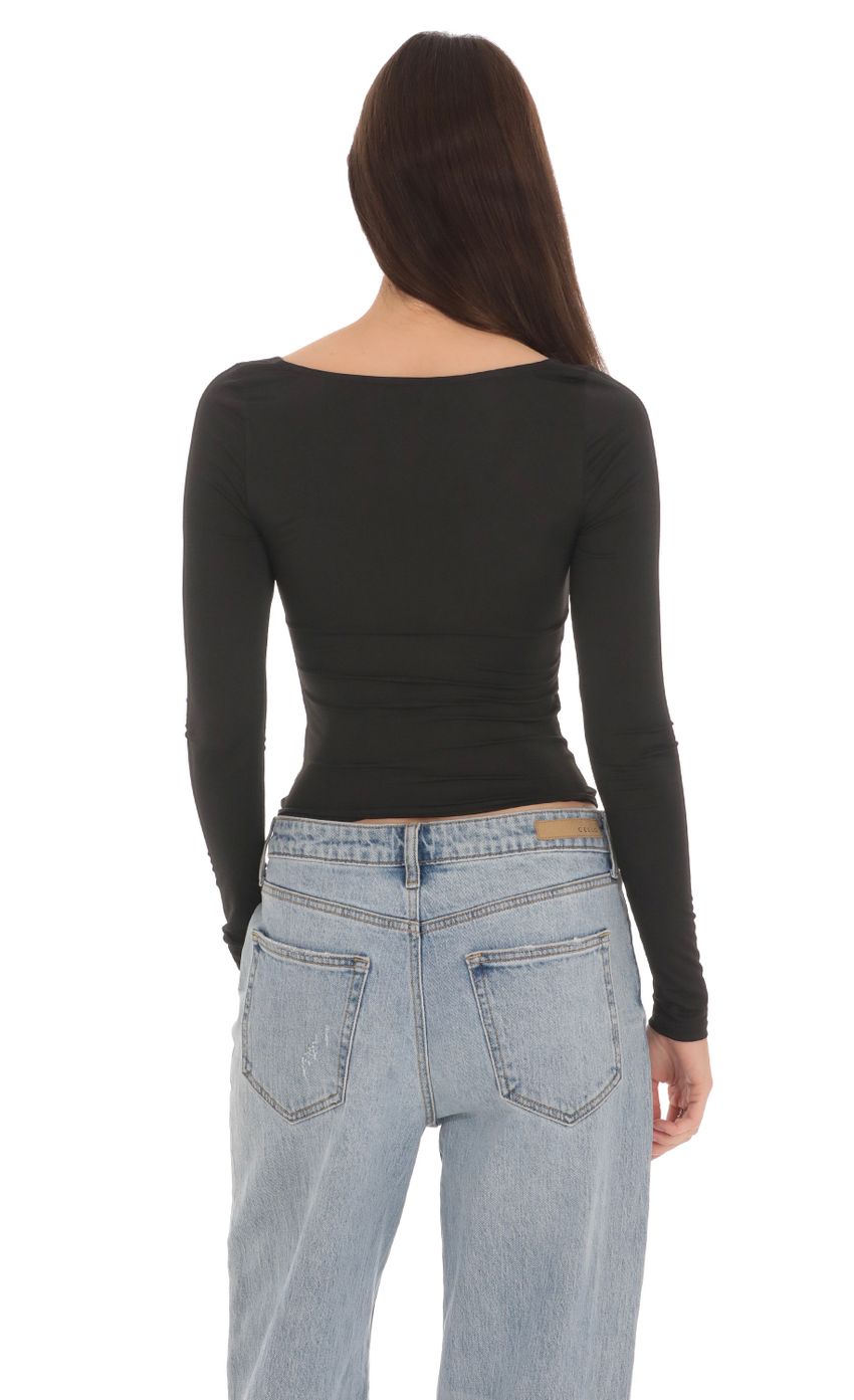Picture Fitted Long Sleeve Top in Black. Source: https://media-img.lucyinthesky.com/data/Apr24/850xAUTO/f9caa6df-a6ce-491f-8852-13bcc04f124d.jpg