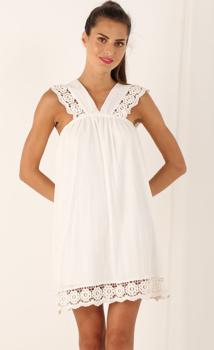 Picture V-Strap Trimmed Shift Dress In White. Source: https://media-img.lucyinthesky.com/data/Aug15_1/850xAUTO/0Y5A2825.JPG