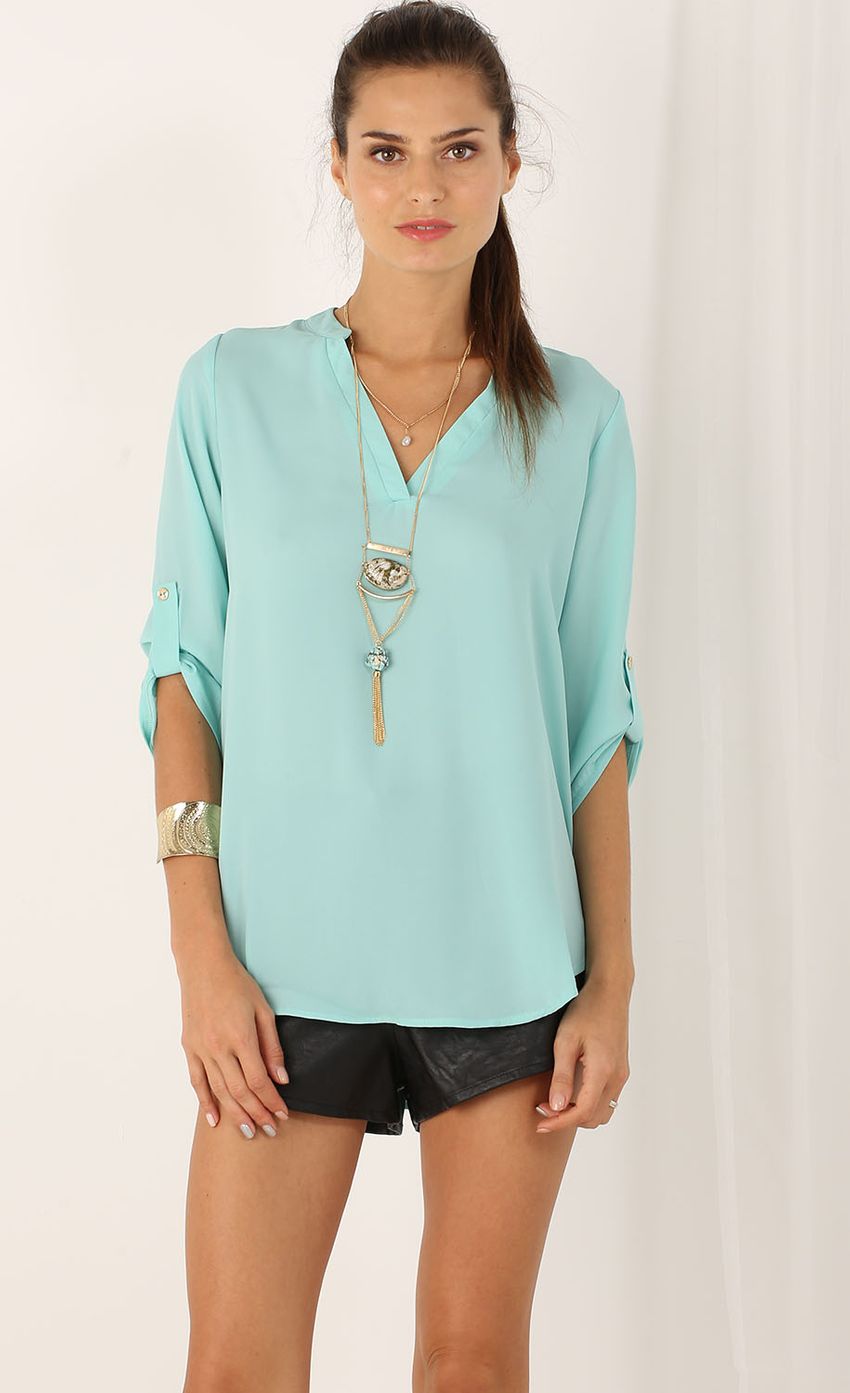 Picture 3/4 Sleeve Buttonless Blouse In Mint. Source: https://media-img.lucyinthesky.com/data/Aug15_1/850xAUTO/0Y5A9092.JPG
