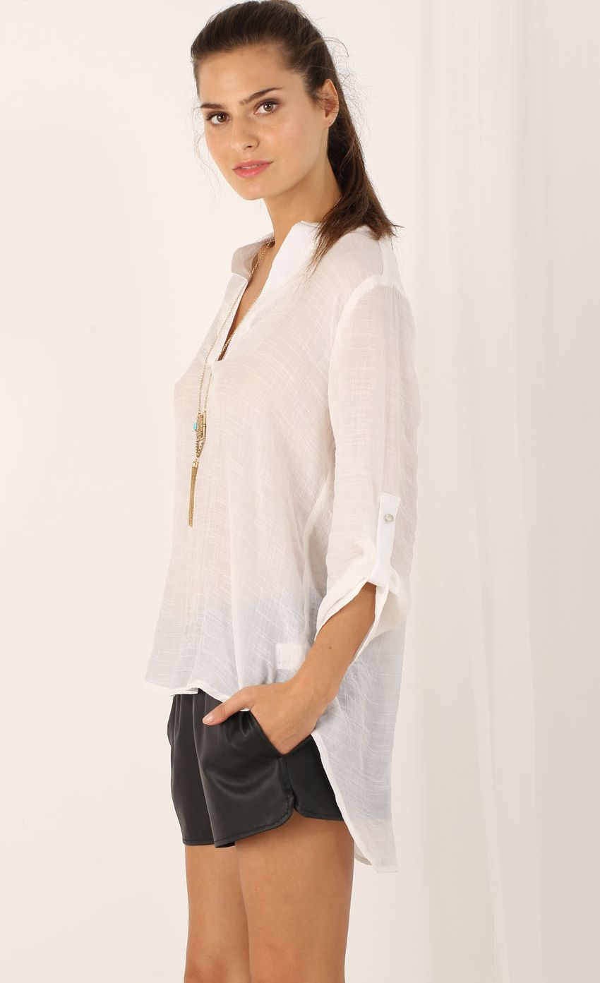 Picture 3/4 Sleeve Buttonless Blouse In White. Source: https://media-img.lucyinthesky.com/data/Aug15_1/850xAUTO/0Y5A9833.JPG