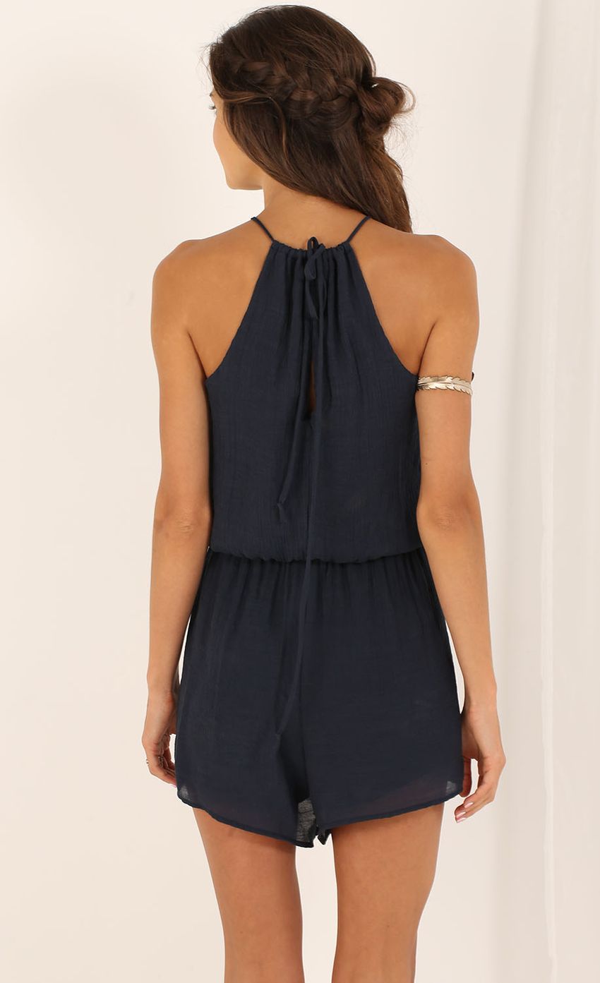 Picture High-Neck Playsuit in Navy Blue. Source: https://media-img.lucyinthesky.com/data/Aug15_2/850xAUTO/0Y5A6196.JPG