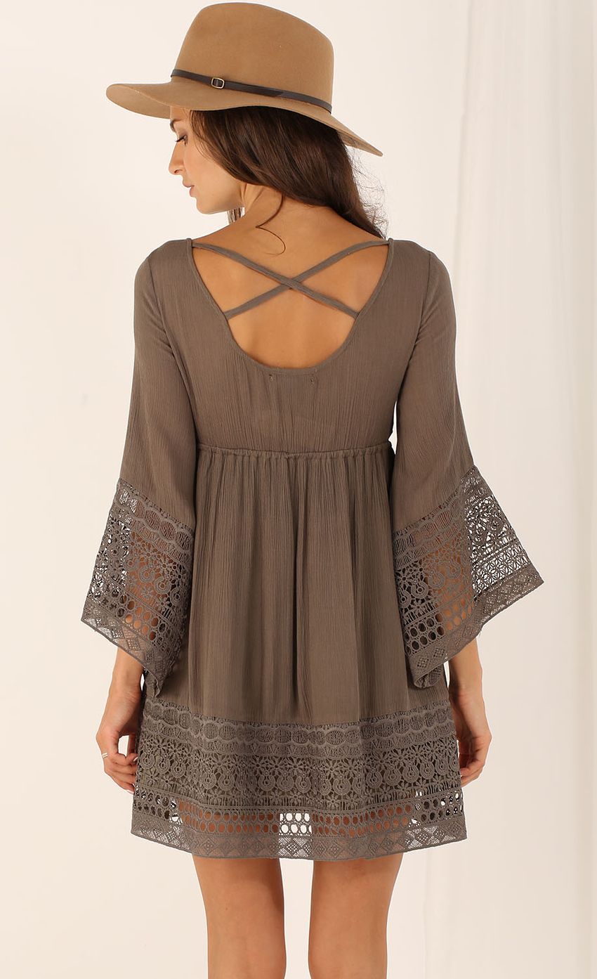 Picture Tunic Dress with Flared Sleeves. Source: https://media-img.lucyinthesky.com/data/Aug15_2/850xAUTO/0Y5A8281.JPG