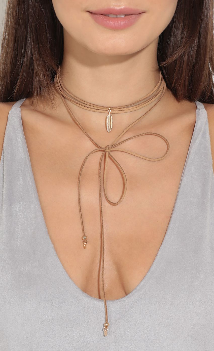 Picture Leaf Embellished Cord Necklace In Tan. Source: https://media-img.lucyinthesky.com/data/Aug16_2/850xAUTO/0Y5A3788.JPG