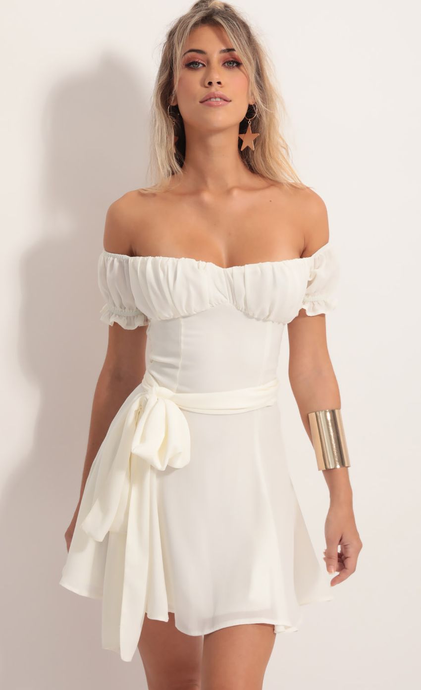 Picture Marnie Ruched Wrap Tie Dress in Ivory White. Source: https://media-img.lucyinthesky.com/data/Aug19_1/850xAUTO/781A5402.JPG