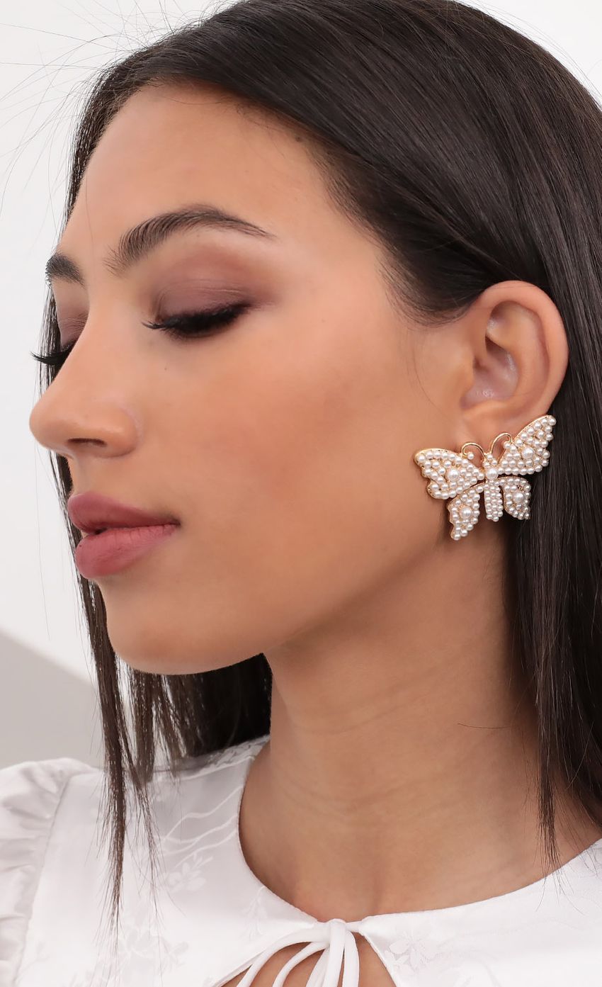 Picture Leona Pearl Butterfly Earrings In Gold. Source: https://media-img.lucyinthesky.com/data/Aug20_2/850xAUTO/781A1093S.JPG