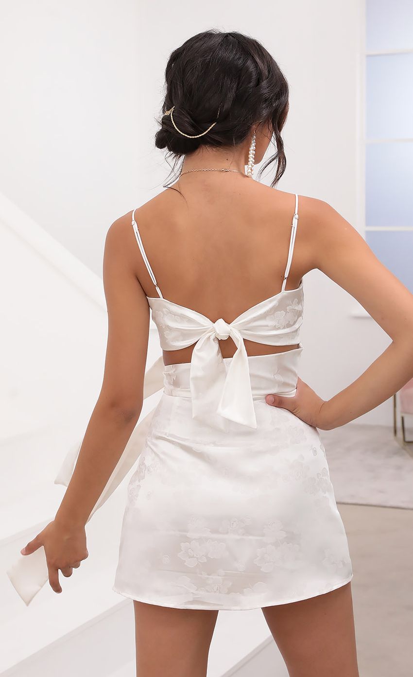 Picture Cutout Tie Dress in White Satin. Source: https://media-img.lucyinthesky.com/data/Aug20_2/850xAUTO/781A7213.JPG