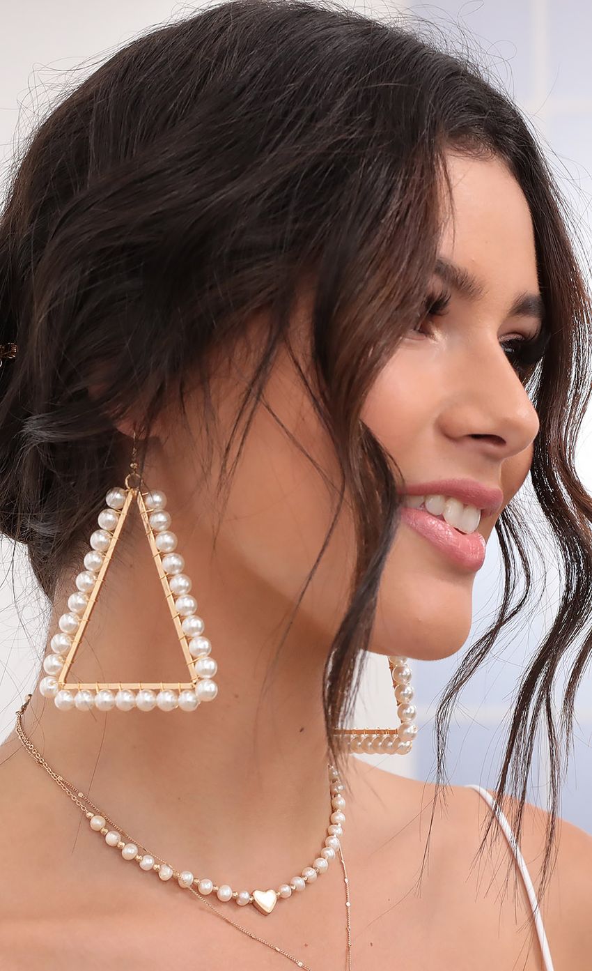 Picture Triangle Pearl Earrings in Gold. Source: https://media-img.lucyinthesky.com/data/Aug20_2/850xAUTO/781A7289.JPG