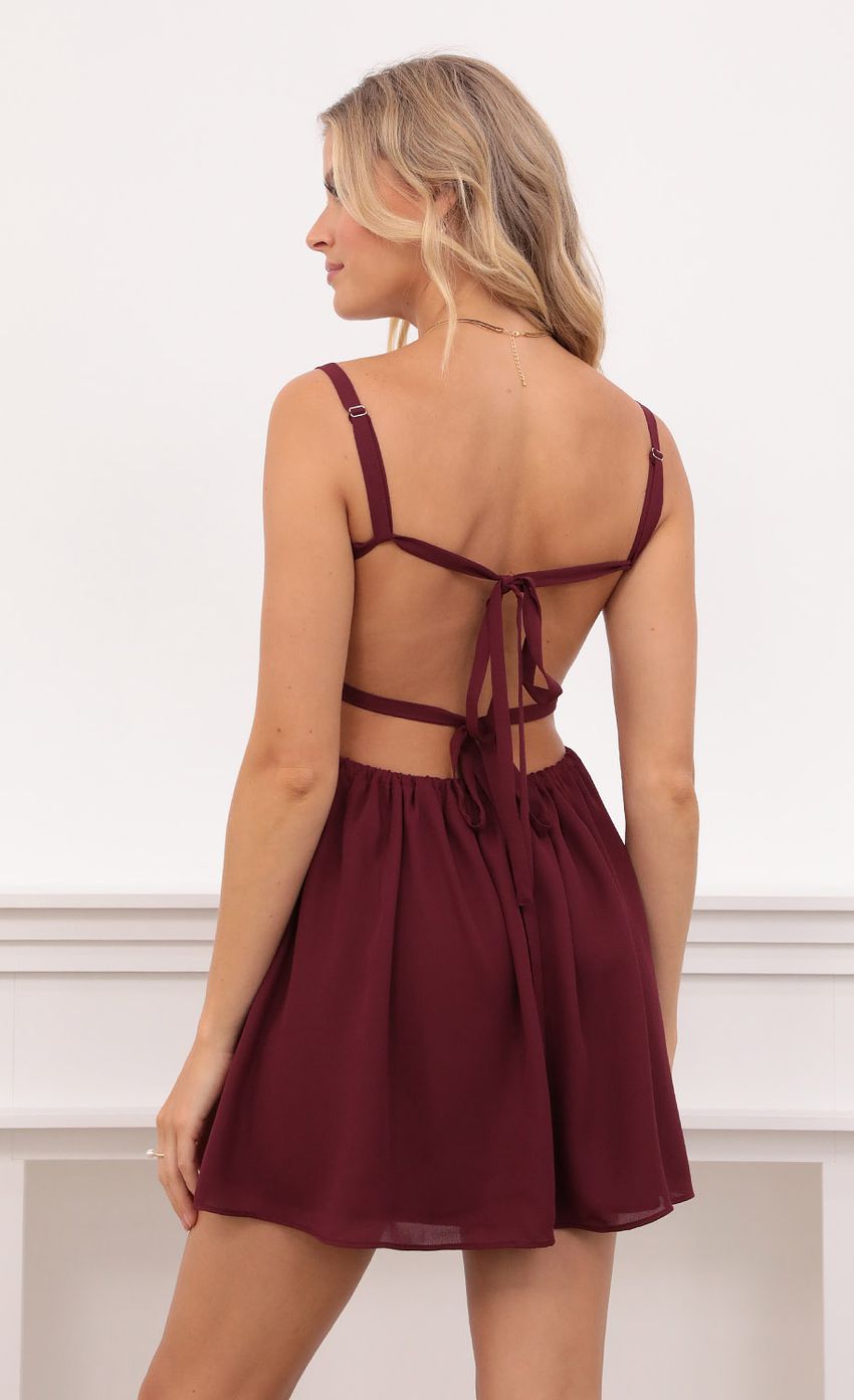 Picture Fit and Flare Dress in Burgundy. Source: https://media-img.lucyinthesky.com/data/Aug21_2/850xAUTO/1V9A2024.JPG