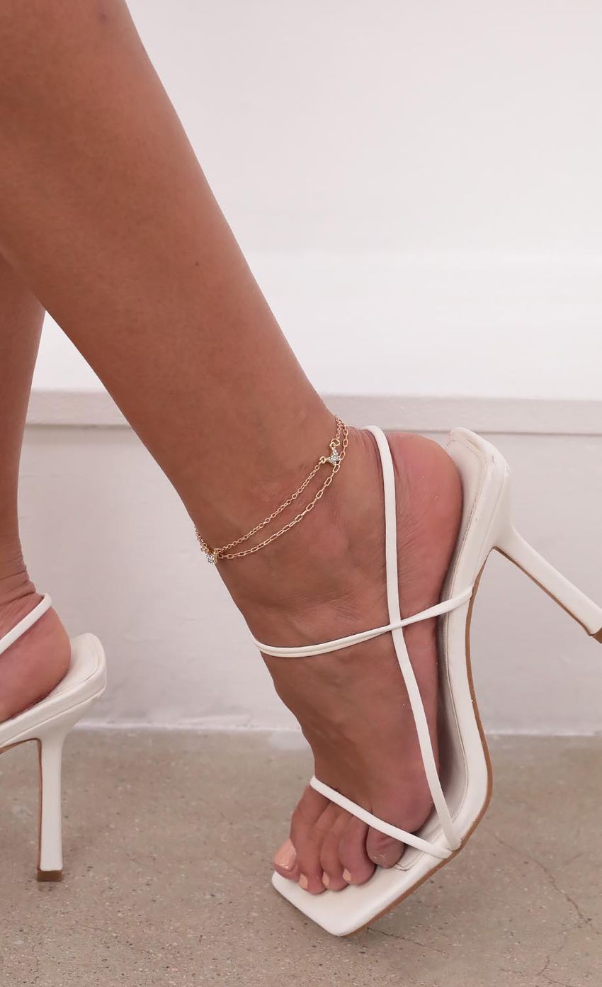 Picture Mystery Wings Layered Anklet in Gold. Source: https://media-img.lucyinthesky.com/data/Aug21_2/850xAUTO/1V9A4118.JPG