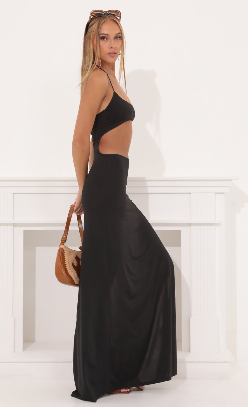 Picture Tummy Cutout Maxi Dress in Black. Source: https://media-img.lucyinthesky.com/data/Aug22/850xAUTO/fcb882fe-7ef3-43b6-b812-776a89f1a4b1.jpg