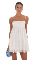 Picture Shimmer Baby Doll Dress in White. Source: https://media-img.lucyinthesky.com/data/Aug23/150xAUTO/13434062-d6cc-4107-b252-6c5ed43ce4f2.jpg