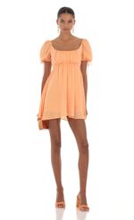 Picture Baby Doll Dress in Orange. Source: https://media-img.lucyinthesky.com/data/Aug23/150xAUTO/13a60cda-2942-4ffe-be6a-efe77a738c38.jpg