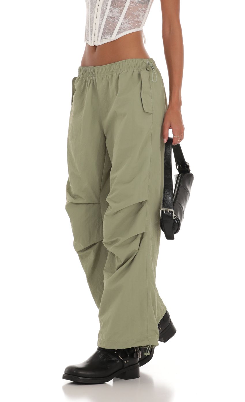 Picture Low Rise Parachute Pants in Green. Source: https://media-img.lucyinthesky.com/data/Aug23/850xAUTO/04c37052-317e-4052-816b-9125ab18c485.jpg