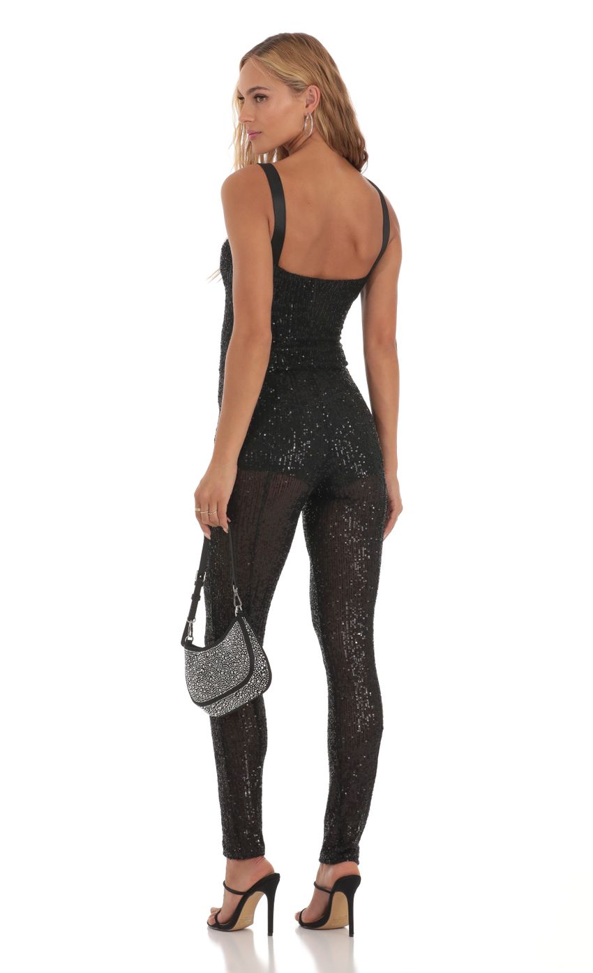 Picture Sequin Jumpsuit in Black. Source: https://media-img.lucyinthesky.com/data/Aug23/850xAUTO/464a525b-4138-4fe1-92d7-5fe6842a0dce.jpg