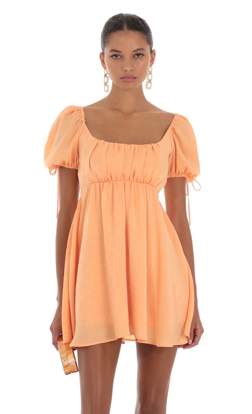 Picture Baby Doll Dress in Orange. Source: https://media-img.lucyinthesky.com/data/Aug23/850xAUTO/7a0b26bf-c11f-46ea-9f7f-9c1731032836.jpg