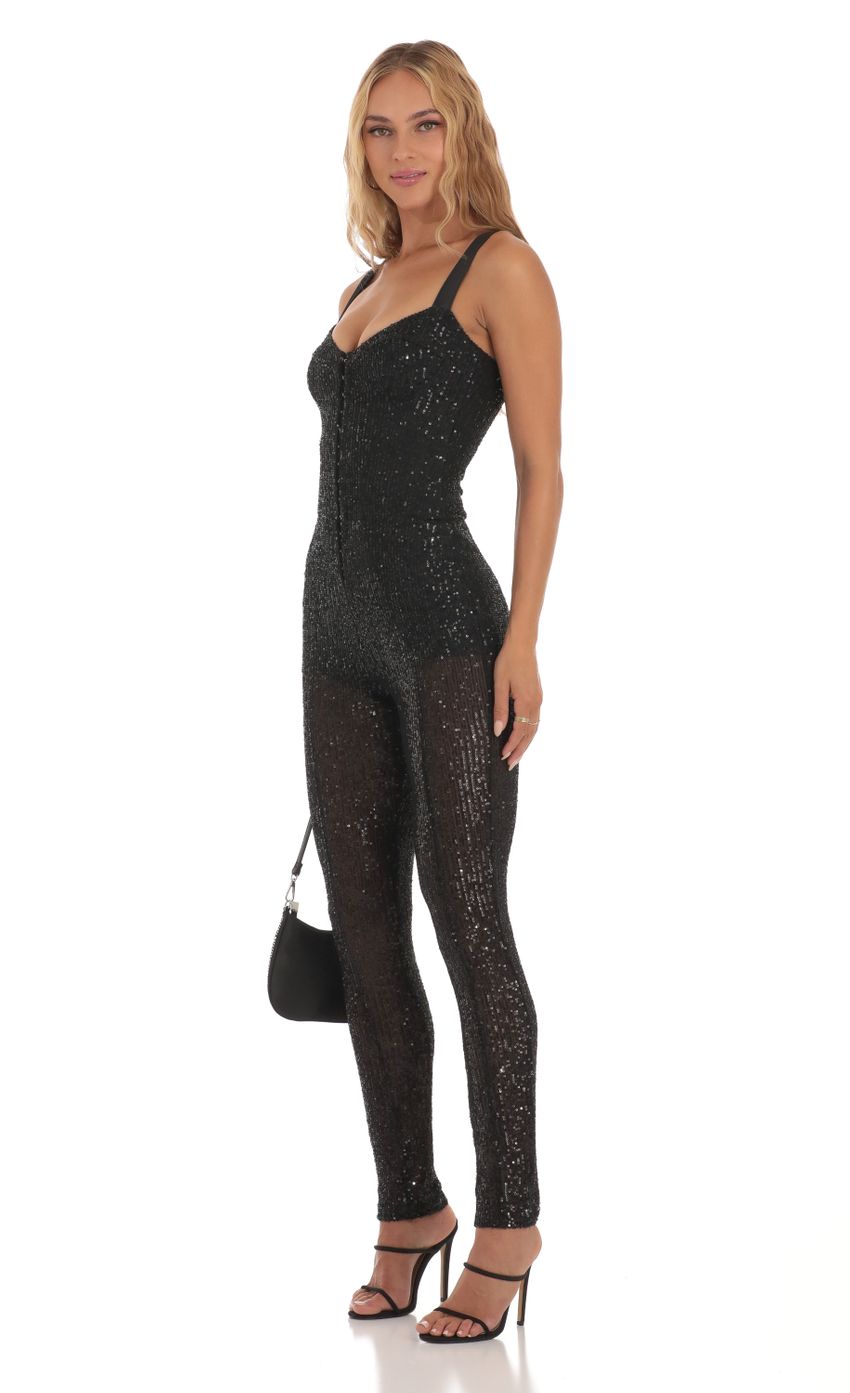 Picture Sequin Jumpsuit in Black. Source: https://media-img.lucyinthesky.com/data/Aug23/850xAUTO/a1ba86ad-a057-466d-8776-3b6017a1a64f.jpg