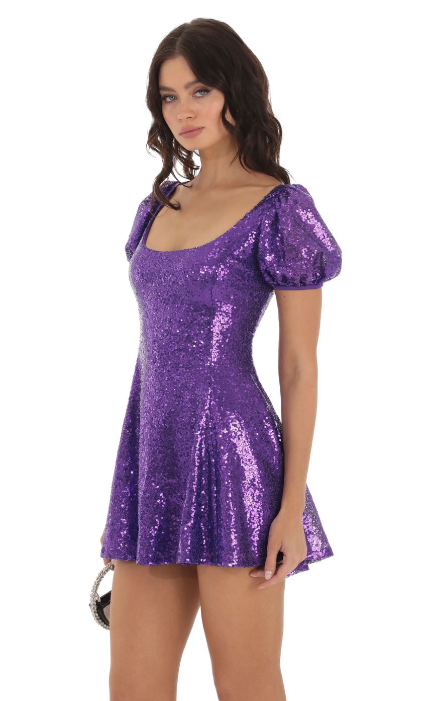 Picture Sequin Puff Sleeve Dress in Purple. Source: https://media-img.lucyinthesky.com/data/Aug23/850xAUTO/be7eaf55-f6b5-4776-8aef-c60d83240f74.jpg