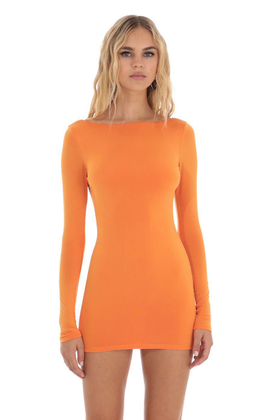 Picture Open Back Dress in Orange. Source: https://media-img.lucyinthesky.com/data/Aug23/850xAUTO/de0019fc-0830-4bc8-81d2-a3bfe3f9d662.jpg