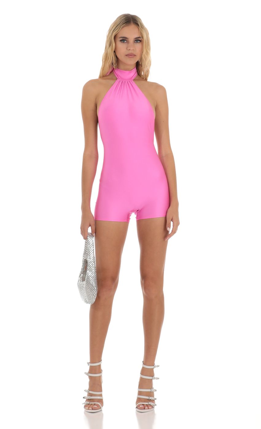 Picture Open Back Romper in Hot Pink. Source: https://media-img.lucyinthesky.com/data/Aug23/850xAUTO/e3c47c8f-f67a-4746-870a-84b3bba22dc7.jpg